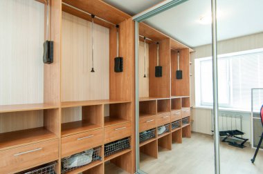 Russia, Moscow- May 21, 2019: interior room apartment. standard repair decoration in hostel. townhouse. dressing room, hangers, storage system