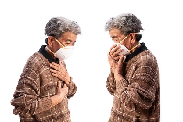 Old woman wearing a mask fear problem air pollution on a white background, healthcare concept.