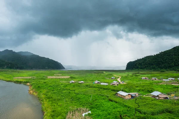 Rantee river mountain raining with village cultivated area