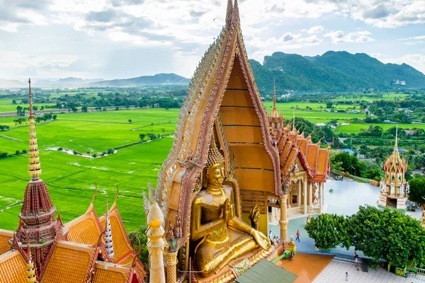 Gold big buddha statue temple wat tham sua, kanchanaburi, thailand
