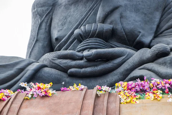 Statue monk buddhist saint sitting with meditation on platform