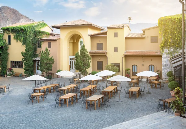 Restaurant cafe table with chair and umbrella in large building elegant at primo piazza, khao yai,sunlight effect