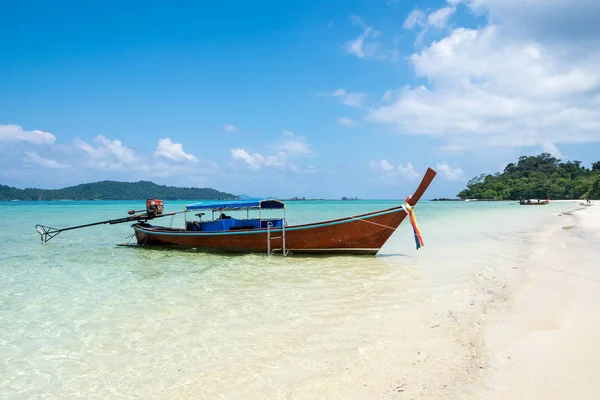 Stock image Long tail wooden boat anchor with csytal sea white sand at lipe island,andaman,thailand