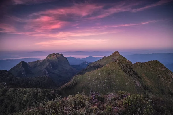 Landscape of mountain range in wildlife sanctuary at colorful sunset. Doi Luang Chiang Dao, Chiang Mai
