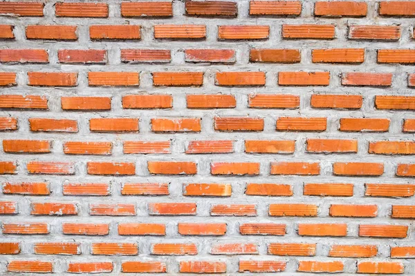 Brick orange on mortar wall background