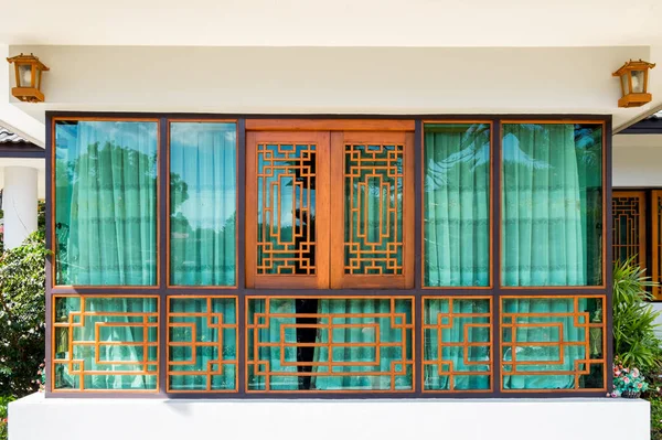 Wooden window and green curtain chinese tracery design
