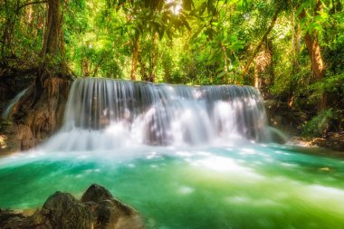 Beautiful Huay Mae Khamin waterfall in tropical rainforest at Srinakarin national park, Kanchanaburi, Thailand clipart