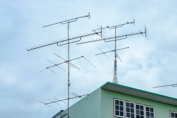 stock image Antenna tv on roof green