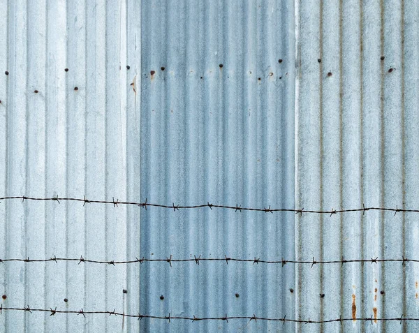 Corrugated blue zinc iron and spire — Stock Photo, Image
