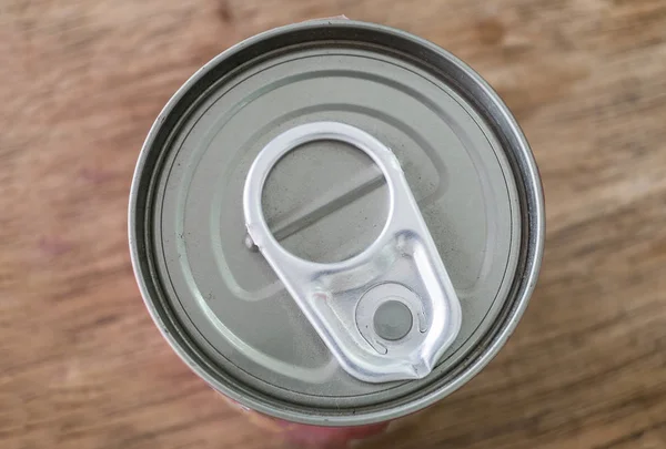 Tin can lid close on table