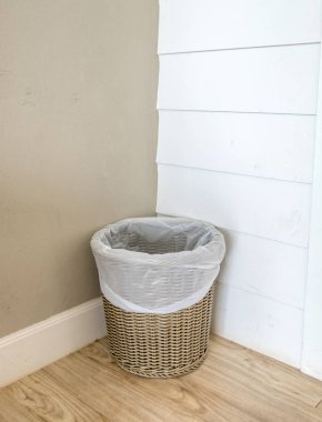 Wooden basket bin on wooden floor clipart