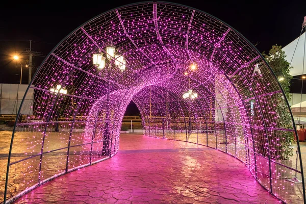 Arch tunnel walkway decorated with pink light — Stock Photo, Image