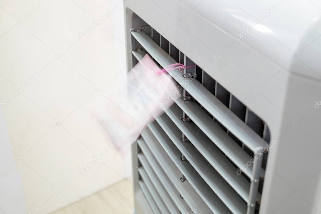 Evaporative air cooler front running blown