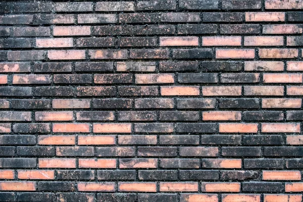 Dirty brick black orange wall — 图库照片