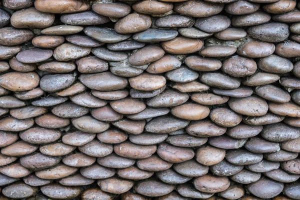 Piedra de pila en la pared — Foto de Stock