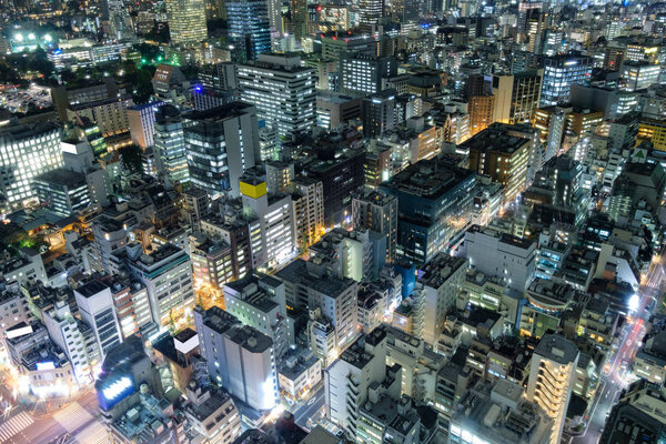 Aerial view of downtown crowded with glowing light at tokyo city