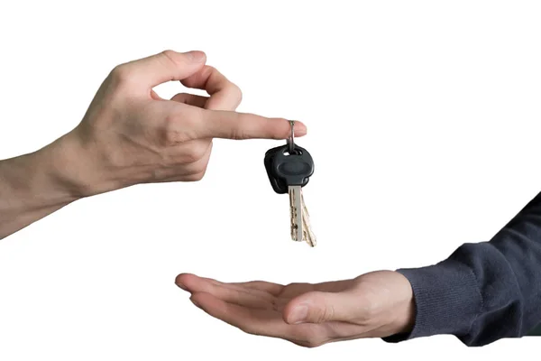 Hand handing over car keys with finger and hand receiving — Stock Photo, Image