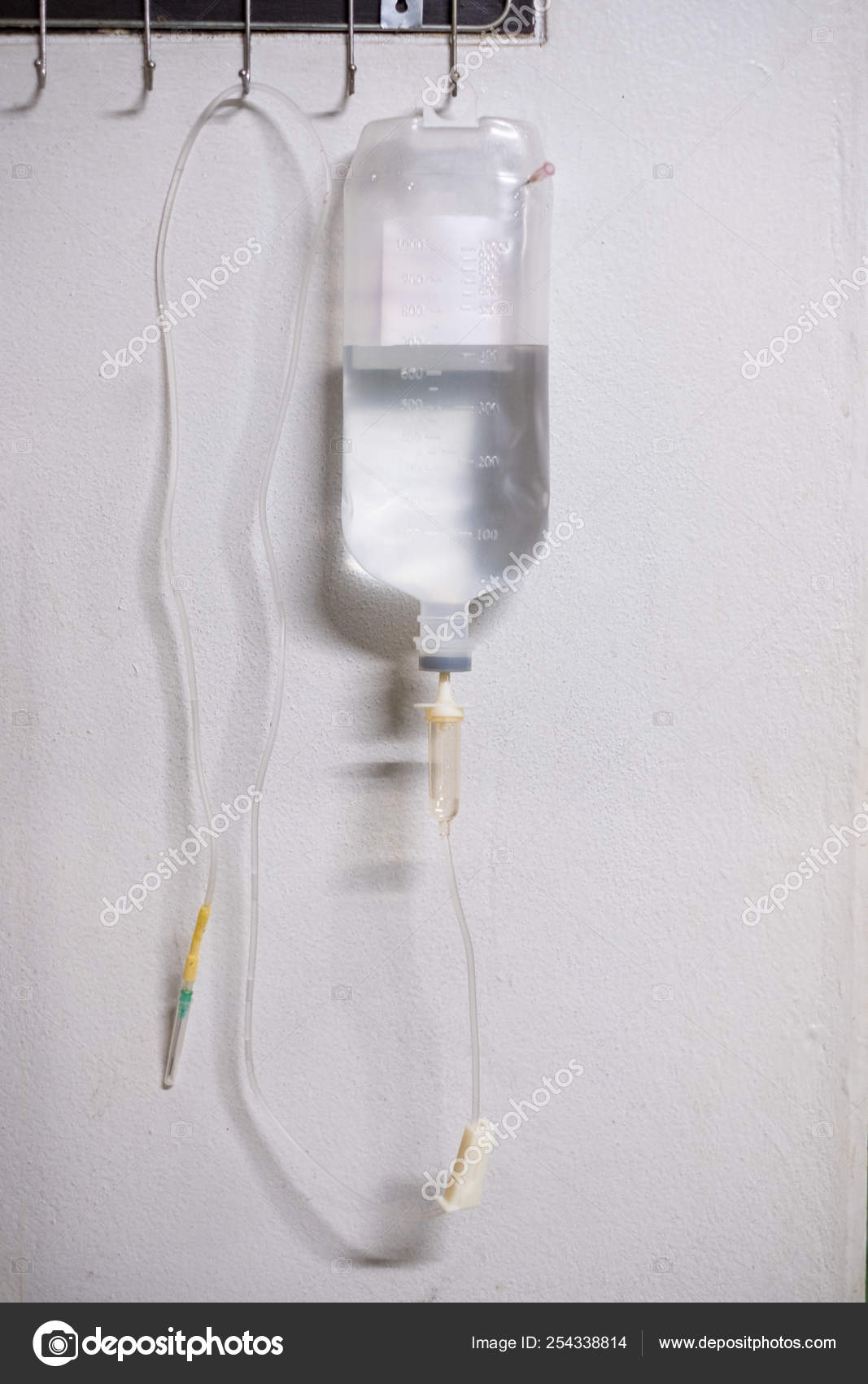Saline solution iv bag with syringe line hanging on wall Stock Photo by  ©Mumemories 254338814