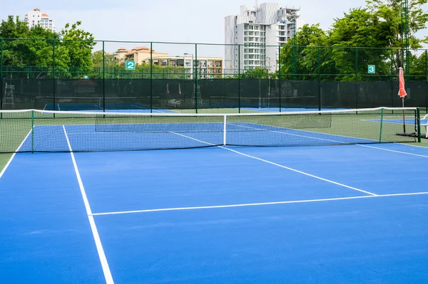 Whole blue tennis court, synthetic rubber lawn