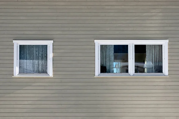 Gray hardwood wall with windows — Stock Photo, Image