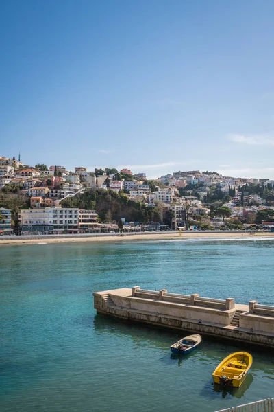 Ulcinj, Karadağ - Nisan 2018: Ulcinj şehir koyda demirlemiş küçük sarı tekne