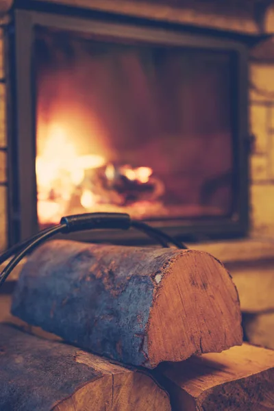 Small pile of firewood stacked next to the fire place at home