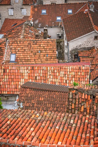 Aerial view of the red tiled houses roofs of Kotor Old town, Montenegro