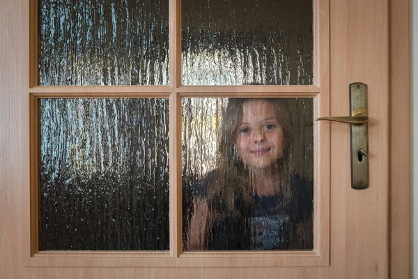 Portrait Cute Little Caucasian Girl Hiding Door Glass Windows While — Stock Photo, Image
