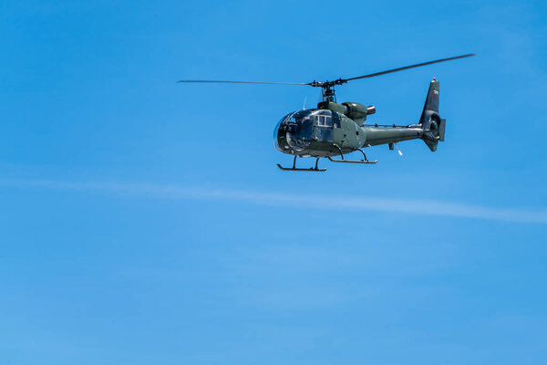 Национальный парк Ловчен, Черногория - апрель 2018 года: военный вертолет пролетает над Которским заливом
