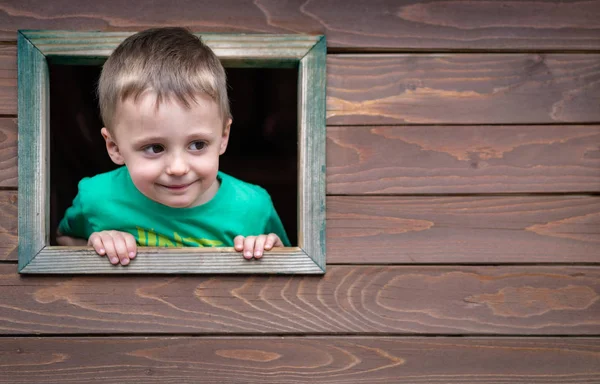 Boy looking through the window Royalty Free Stock Images
