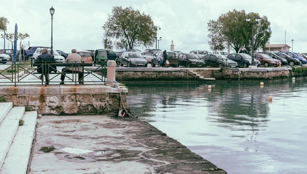 Older man on a bench in Zakynthos Port — Stock Photo, Image