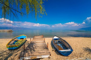 Small boats on the shore of Lake Ohrid clipart