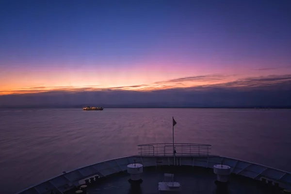 Front of a large passenger ferry sailing at dawn — Stock Photo, Image