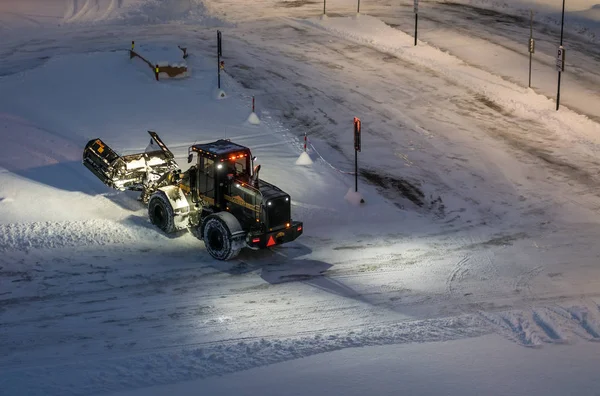 Powerful snowplough clearing parking lot — Stock Photo, Image