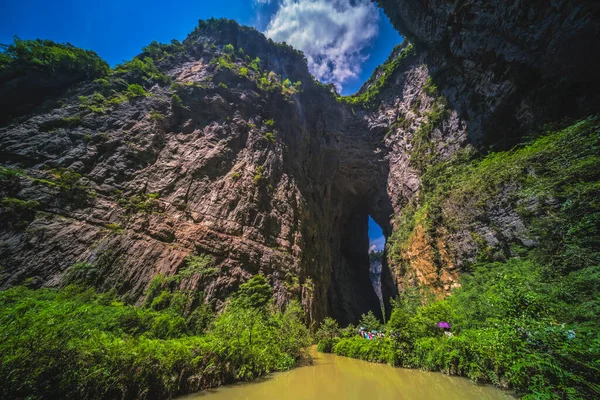 Tourists Walking Path Muddy Water Stream Flowing Landscape Massive Vertical — Stock Photo, Image