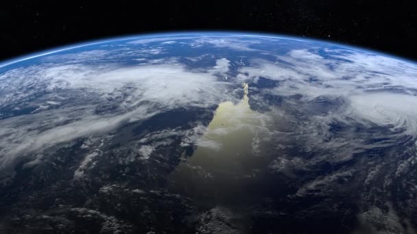 Earth from space. Stars twinkle. The earth rotates to the left. Flight over the Earth. 4K. Sunrise. The earth slowly rotates. Realistic atmosphere. 3D Volumetric clouds. — Stock Video