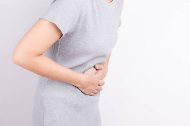 asian woman having stomachache on white background clipart
