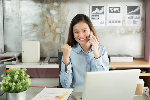 New generation business woman using smartphone,Asian woman are happily working in the office,Working Successful Concept