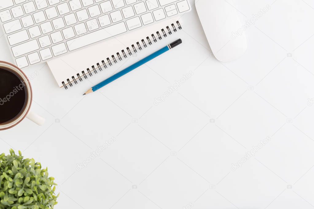 Flat lay photo of office desk with mouse and pencil on white background