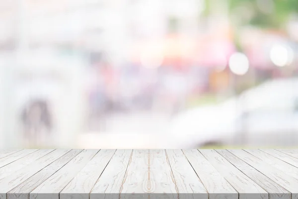 White wood table top on blurred background from shopping mall. — Stock Photo, Image