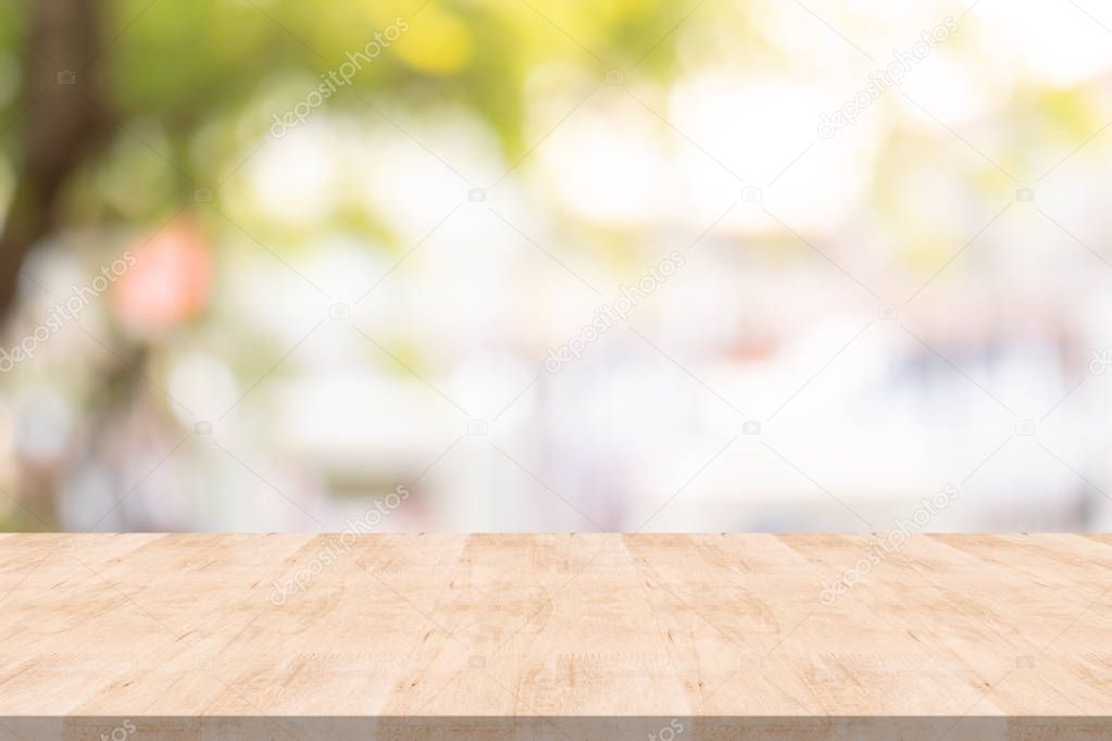 Wood table top on blurred background at garden,for montage your  products