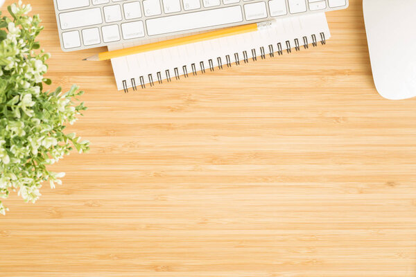 Flat lay photo of office desk with mouse and keyboard 