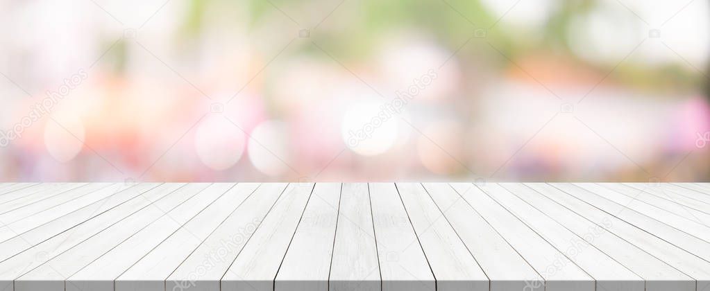 white wood table top on blurred background from shopping mall