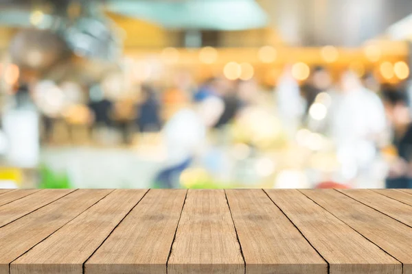 Empty brown wood table top on blurred background at coffee shop — Stock Photo, Image