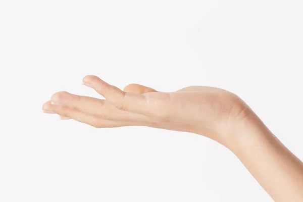 Mano de mujer mostrando sobre fondo blanco — Foto de Stock