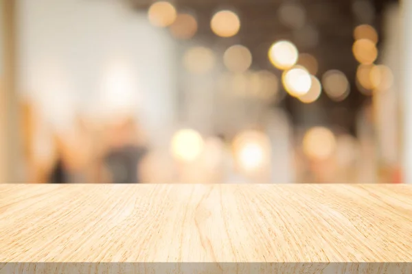 Wood table top on blurred background at coffee shop — Stock Photo, Image