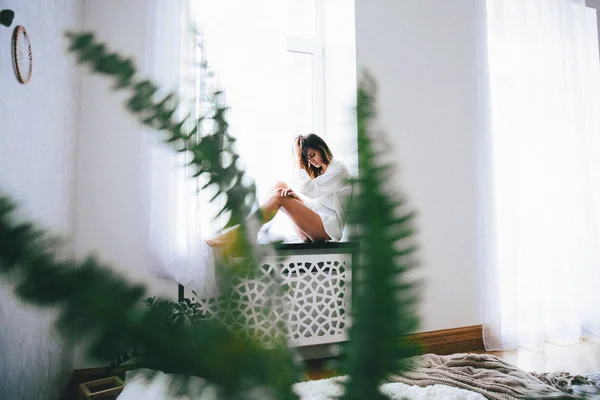 Young Woman Sitting Windowsill Bedroom Home Stock Photo