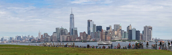 Panorama view of New York Skyline with skyscrapers. Midtown Manhattan view from Liberty Island.