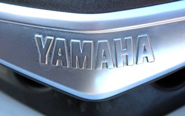 Vinnytsia, Ukraine; September 06, 2025. Close-up Yamaha nameplate with embossed silver letters on metallic surface. Close up Yamaha logo. Yamaha Motor Company logo and emblem. 