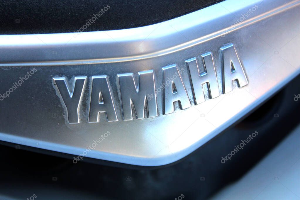 Vinnytsia, Ukraine; September 06, 2025. Close-up Yamaha nameplate with embossed silver letters on metallic surface. Close up Yamaha logo. Yamaha Motor Company logo and emblem.
